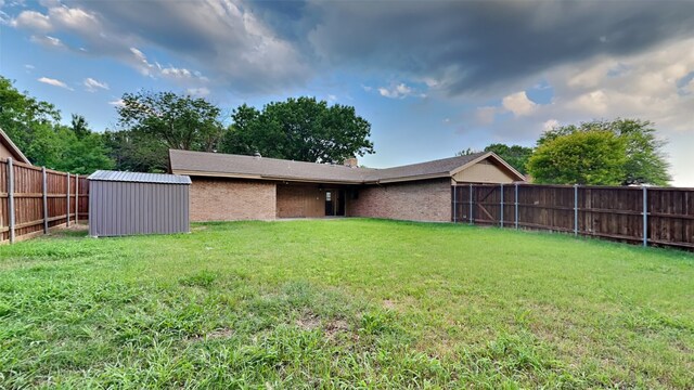 108 Meadowcrest Dr, Desoto, TX 75115 - view of yard featuring a shed and an outbuilding