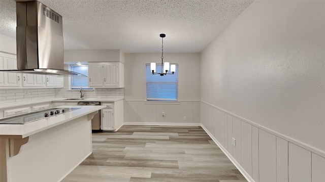 108 Meadowcrest Dr, Desoto, TX 75115 - kitchen with island exhaust hood, white cabinets, a textured ceiling, a sink, and dishwasher