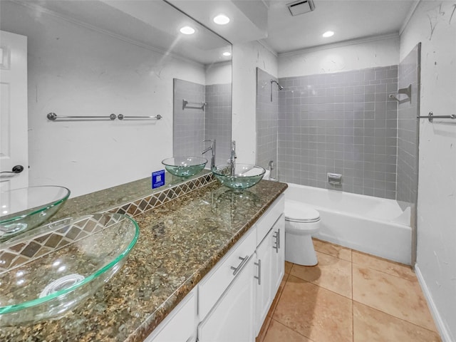 2303 Ox Bow Ct, Arlington, TX 76006 - bathroom featuring double vanity, toilet, tile patterned floors,  shower combination, and baseboards