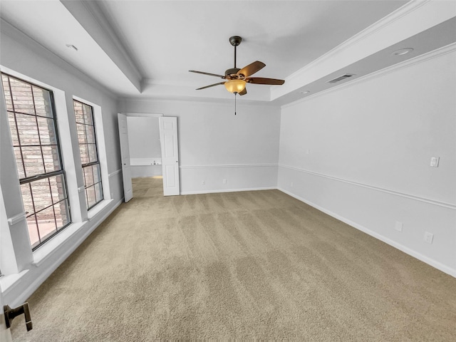 2303 Ox Bow Ct, Arlington, TX 76006 - empty room featuring a raised ceiling, light carpet, a ceiling fan, baseboards, and crown molding