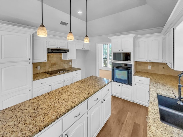 2303 Ox Bow Ct, Arlington, TX 76006 - kitchen with black appliances, light stone counters, light wood-style flooring, white cabinetry, and recessed lighting