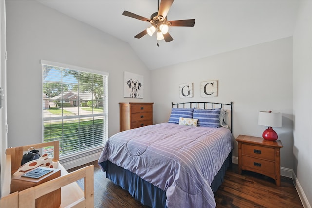 bedroom featuring multiple windows, vaulted ceiling, wood finished floors, and baseboards