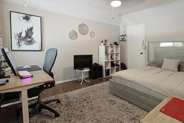 228 Mccarley Pl, Mckinney, TX 75071 - bedroom with lofted ceiling, wood finished floors, baseboards, and an office area
