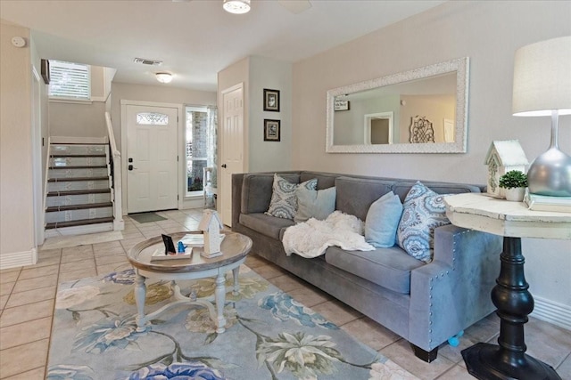 228 Mccarley Pl, Mckinney, TX 75071 - tiled living area with stairs and baseboards