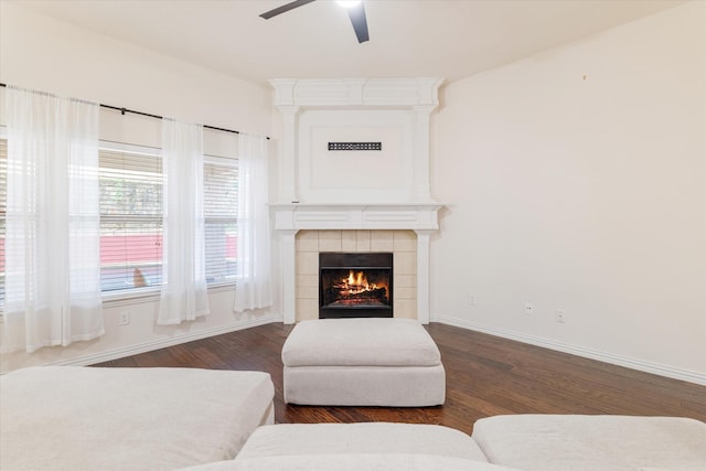 505 Osage Dr, Mckinney, TX 75071 - living area featuring wood finished floors, ceiling fan, a tiled fireplace, and baseboards