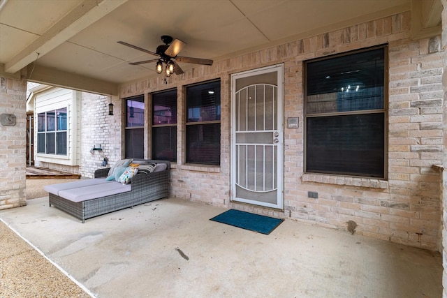 505 Osage Dr, Mckinney, TX 75071 - view of exterior entry with ceiling fan, a patio, and brick siding