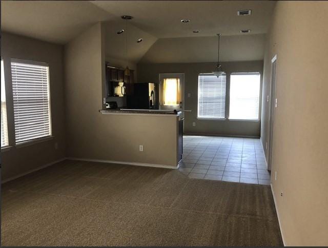 1837 Walnut Way, Anna, TX 75409 - kitchen featuring fridge, black microwave, carpet floors, a peninsula, and baseboards