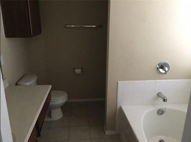 1837 Walnut Way, Anna, TX 75409 - bathroom featuring a bath, vanity, toilet, tile patterned flooring, and baseboards