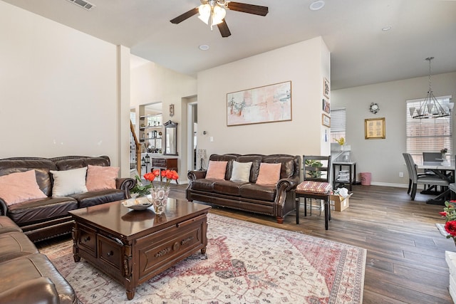 7013 Caldwell Ln, Plano, TX 75025 - living room featuring a ceiling fan, light wood-style flooring, a chandelier, baseboards, and recessed lighting