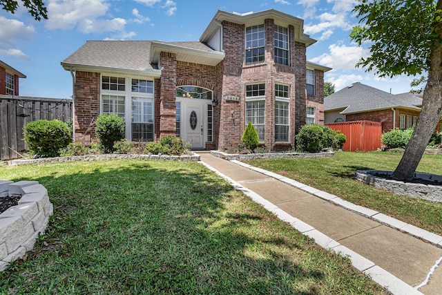 7013 Caldwell Ln, Plano, TX 75025 - traditional home with brick siding and roof with shingles