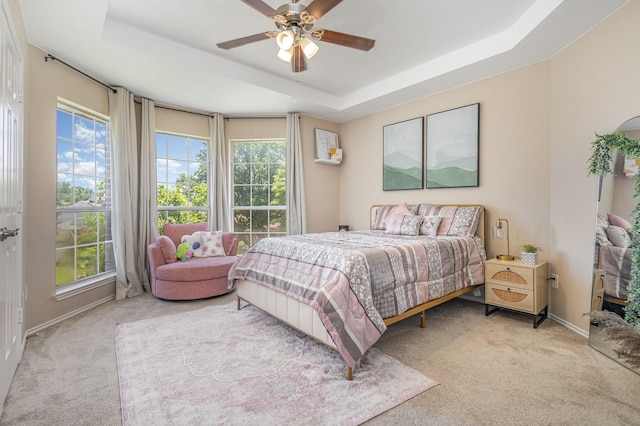7013 Caldwell Ln, Plano, TX 75025 - bedroom featuring carpet, a raised ceiling, baseboards, and ceiling fan