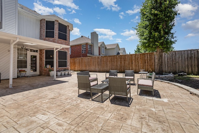 7013 Caldwell Ln, Plano, TX 75025 - fenced backyard with a patio, ceiling fan, and outdoor dining area