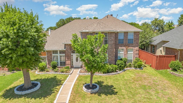 7013 Caldwell Ln, Plano, TX 75025 - traditional-style home featuring brick siding, a chimney, and a shingled roof