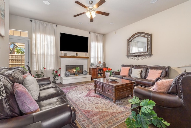7013 Caldwell Ln, Plano, TX 75025 - living room featuring a ceiling fan, healthy amount of natural light, wood finished floors, a fireplace, and recessed lighting