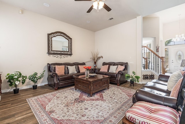 7013 Caldwell Ln, Plano, TX 75025 - living room featuring ceiling fan, baseboards, dark wood-style flooring, a chandelier, and stairs