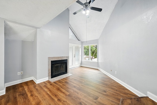 2312 Balsam Dr Unit A206, Arlington, TX 76006 - unfurnished living room featuring a textured ceiling, a ceiling fan, wood finished floors, a fireplace, and baseboards