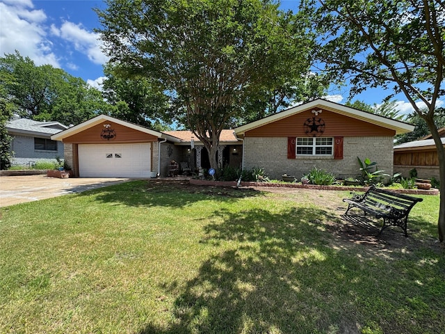 single story home featuring brick siding, a garage, a front yard, and driveway