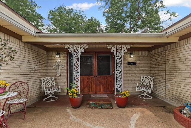 5016 Wyoming Trl, North Richland Hills, TX 76180 - property entrance featuring brick siding and a porch