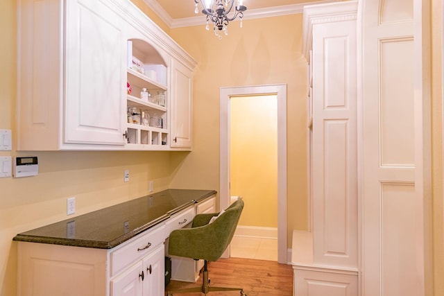 office area featuring crown molding, light wood-style flooring, a chandelier, and baseboards