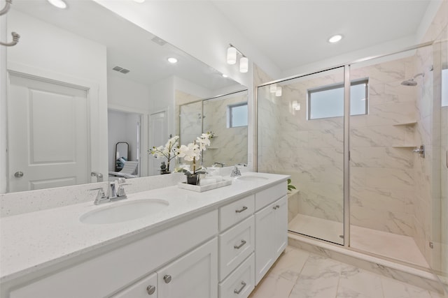 13037 Cabana Dr, Frisco, TX 75035 - ensuite bathroom with a shower stall, marble look tiles, double vanity, and recessed lighting