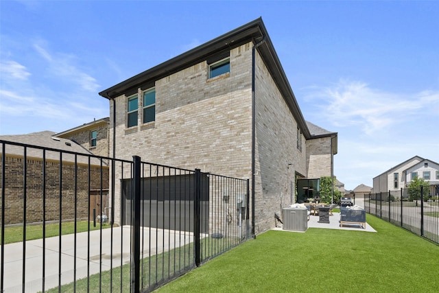 13037 Cabana Dr, Frisco, TX 75035 - back of property featuring brick siding, central AC, a patio area, and a gate