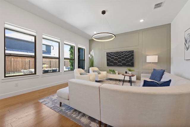 13037 Cabana Dr, Frisco, TX 75035 - living room featuring wood finished floors, recessed lighting, and baseboards