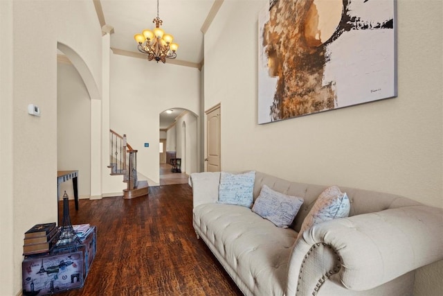 6725 S Fork Dr, North Richland Hills, TX 76182 - living room with arched walkways, a chandelier, wood finished floors, stairway, and ornamental molding