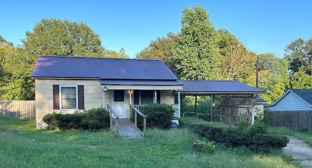 509 Piermont Dr, Atlanta, TX 75551 - view of front of house featuring fence and metal roof