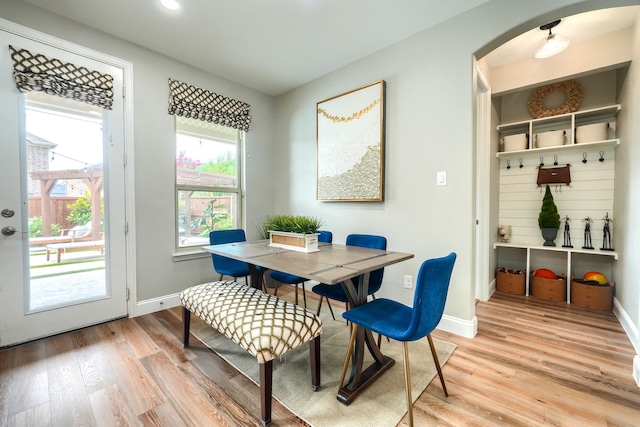 4533 Cheetah Trl, Frisco, TX 75034 - dining space with arched walkways, light wood-type flooring, baseboards, and recessed lighting