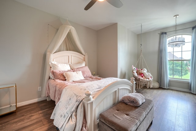 4533 Cheetah Trl, Frisco, TX 75034 - bedroom featuring dark wood-style floors, a chandelier, baseboards, and ceiling fan