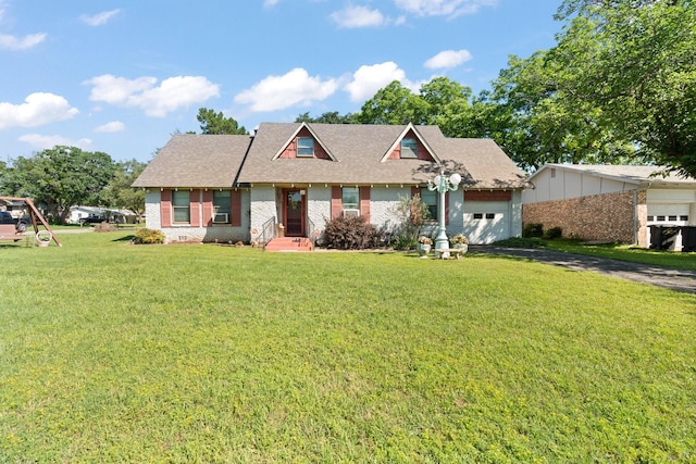 708 Lilly St, Cleburne, TX 76033 - view of front of property with brick siding, a garage, driveway, a front yard, and a shingled roof
