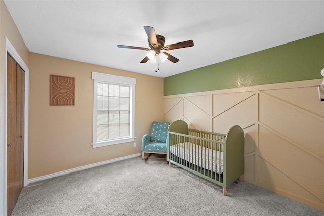 308 W Spring Valley Dr, Hewitt, TX 76643 - carpeted bedroom featuring a ceiling fan, baseboards, and a nursery area