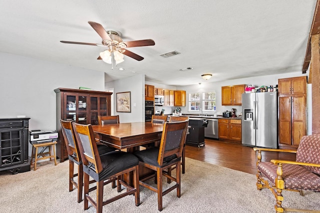1801 Beavers Pt, Bonham, TX 75418 - dining space with dark colored carpet and ceiling fan