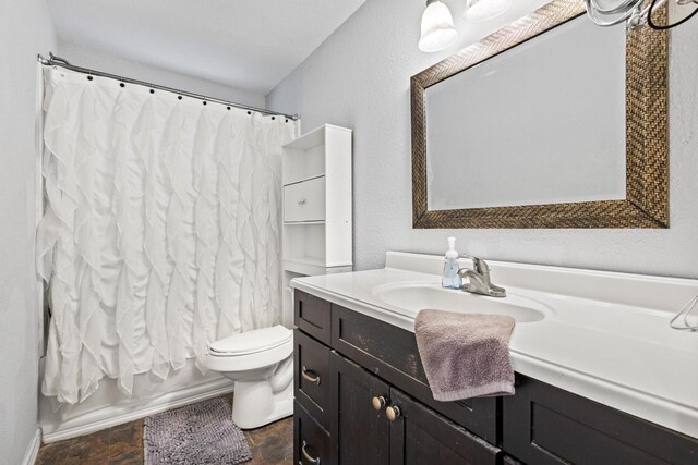 1801 Beavers Pt, Bonham, TX 75418 - bathroom with toilet, vanity, and shower / tub combo