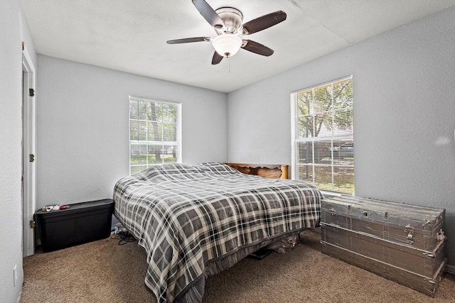 1801 Beavers Pt, Bonham, TX 75418 - bedroom featuring carpet flooring, multiple windows, and ceiling fan