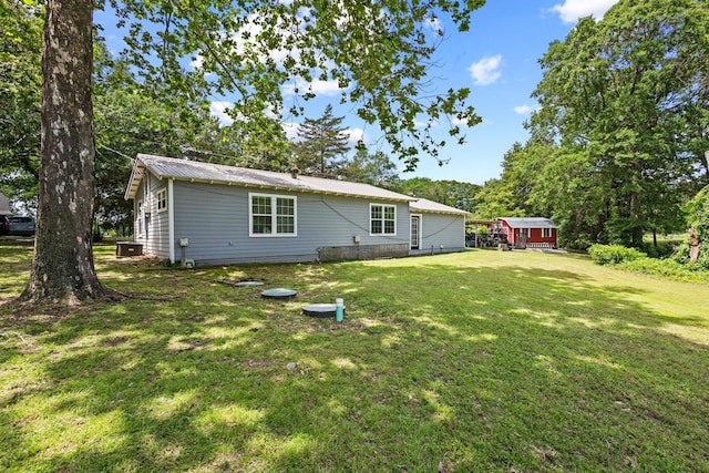 1801 Beavers Pt, Bonham, TX 75418 - back of house with a lawn and metal roof