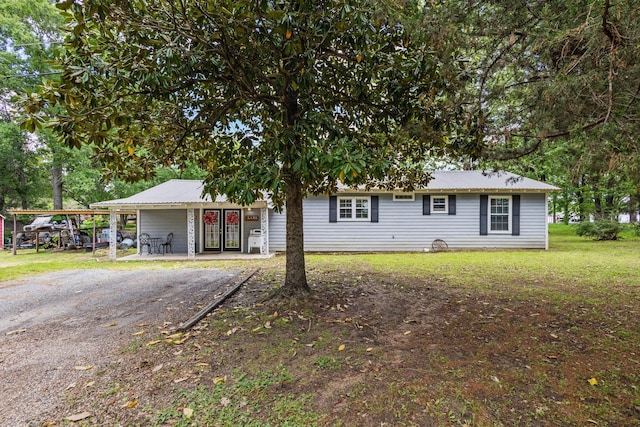 1801 Beavers Pt, Bonham, TX 75418 - ranch-style home with a front yard and metal roof