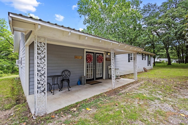 1801 Beavers Pt, Bonham, TX 75418 - rear view of house with french doors, a patio area, and a yard