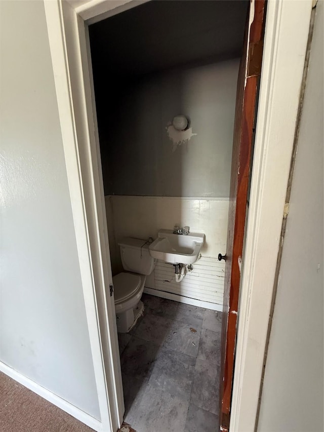 701 Perry, Santa Anna, TX 76878 - half bath featuring a sink and toilet