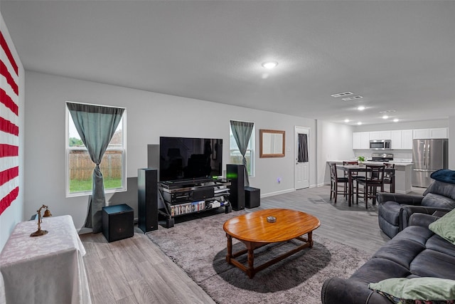 111 Peace Lily Way, Tolar, TX 76476 - living area with light wood-type flooring, recessed lighting, and baseboards