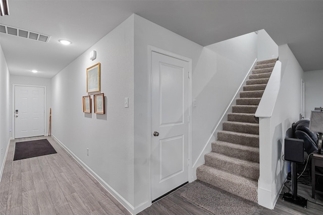 111 Peace Lily Way, Tolar, TX 76476 - staircase featuring wood finished floors, baseboards, and recessed lighting
