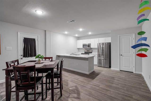 111 Peace Lily Way, Tolar, TX 76476 - dining room featuring baseboards, recessed lighting, and dark wood-style flooring
