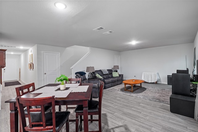 111 Peace Lily Way, Tolar, TX 76476 - dining space featuring light wood-style flooring, baseboards, stairway, and recessed lighting