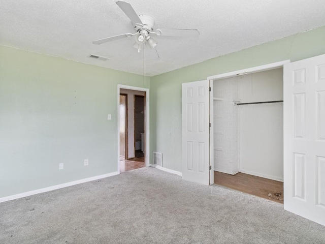 110 Twin Cir, Wortham, TX 76693 - unfurnished bedroom with carpet, a closet, baseboards, ceiling fan, and a textured ceiling