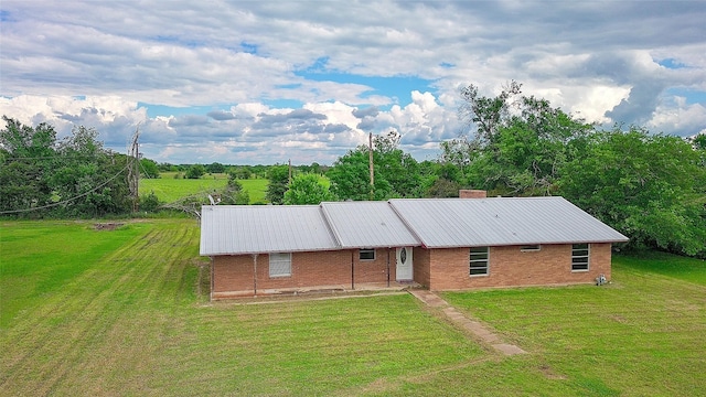 110 Twin Cir, Wortham, TX 76693 - single story home featuring a front yard, brick siding, and metal roof