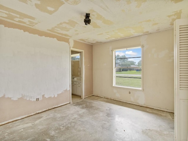 110 Twin Cir, Wortham, TX 76693 - unfurnished room with concrete floors