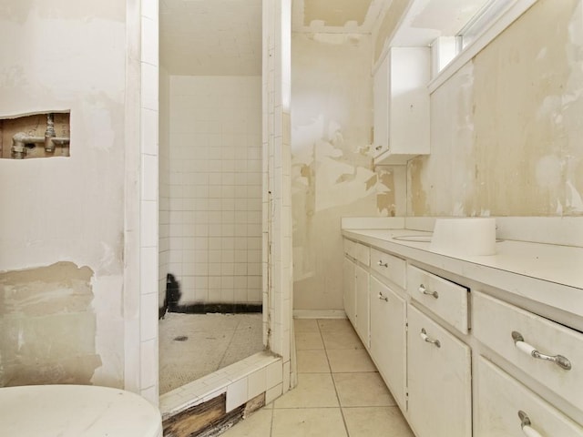 110 Twin Cir, Wortham, TX 76693 - bathroom featuring tile patterned floors, a stall shower, and vanity