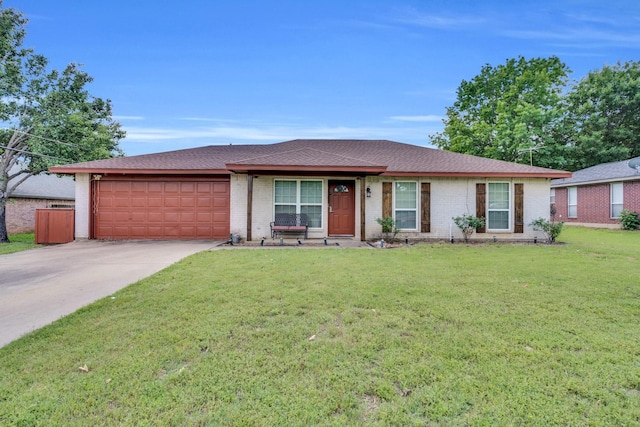 208 Lone Star St, Joshua, TX 76058 - ranch-style house with an attached garage, concrete driveway, a front lawn, a shingled roof, and brick siding