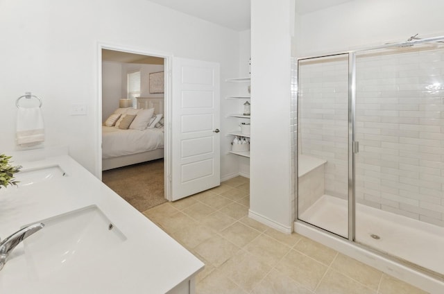 901 Violet Way, Celina, TX 75009 - full bathroom with a stall shower, ensuite bath, tile patterned flooring, double vanity, and baseboards