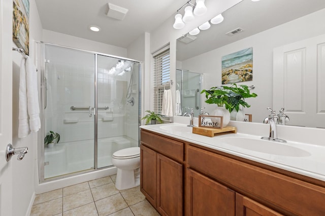 7735 Whirlwind Dr, Frisco, TX 75036 - bathroom with tile patterned flooring, a stall shower, double vanity, and toilet